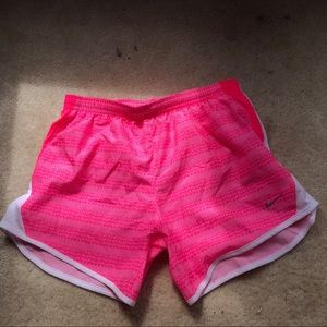 Pink Nike track shorts